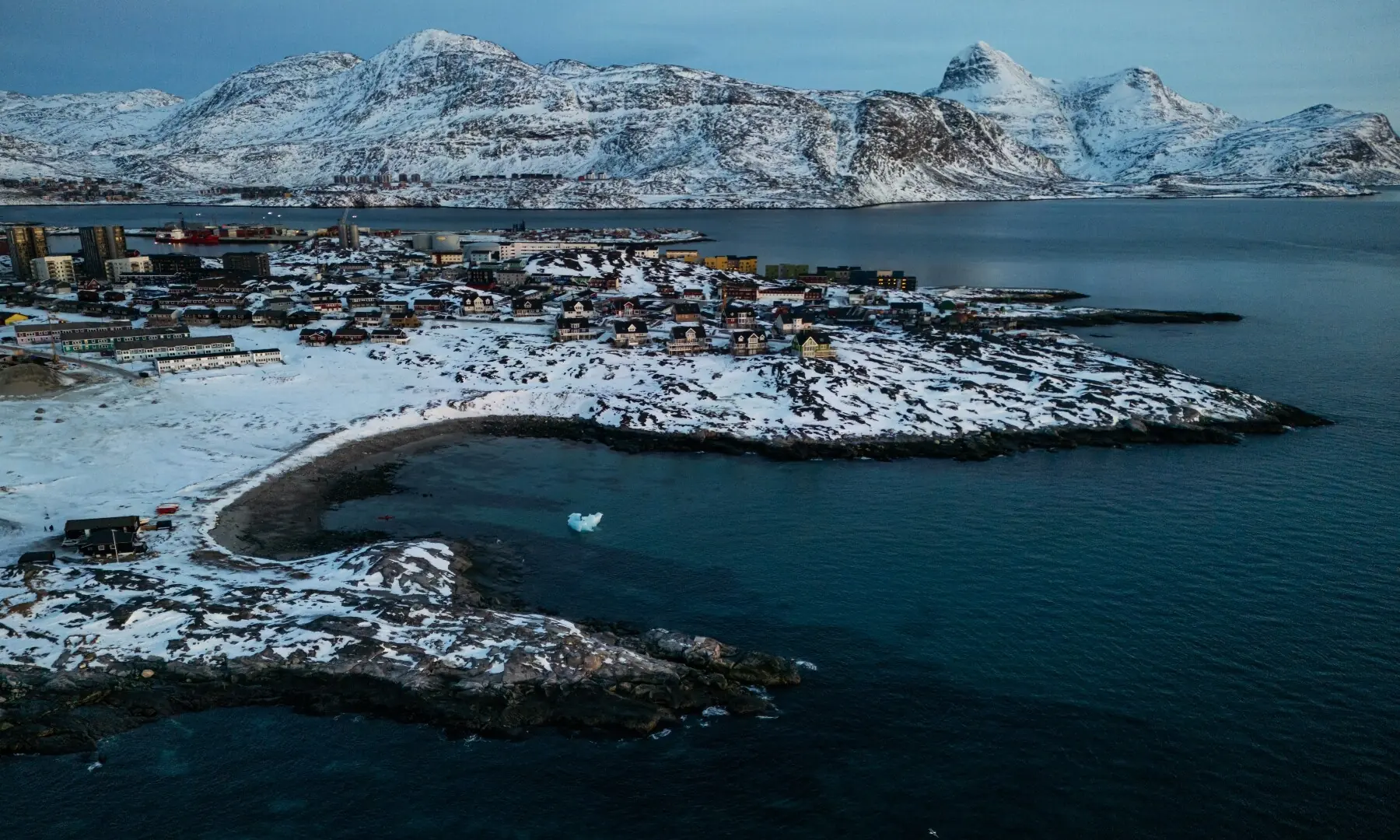 This aerial view taken on January 25, 2026 shows the city of Nuuk covered in snow along the coastline of western Greenland. &mdash; Jonathan Nackstrand/ AFP
