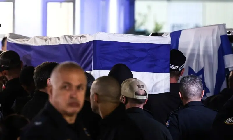Police gather around the coffin of Israeli police officer, and the last hostage Ran Gvili who was kidnapped in the October 7, 2023, Hamas attack and was found and identified in the Gaza Strip, according to the statement by the Israeli military, at the Institute of Forensic Medicine in Tel Aviv, Israel, January 26. &mdash; Reuters