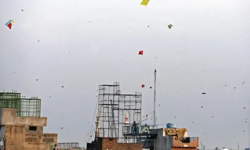 In this February 2022 photo, kites dot the sky as youngsters celebrate Basant in Rawalpindi&rsquo;s Banni area. &mdash; Photo by Mohammad Asim/File
