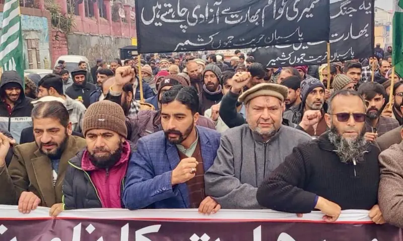 Participants of a rally organised by Pasban-e-Hurriyat Jammu Kashmir (PHJK) chant slogans as they march through a main thoroughfare in Muzaffarabad to protest India’s claims of being the largest democracy. — photo by author Participants of a rally organised by Pasban-e-Hurriyat Jammu Kashmir (PHJK) chant slogans as they march through a main thoroughfare in Muzaffarabad to protest India’s claims of being the largest democracy. — photo by author