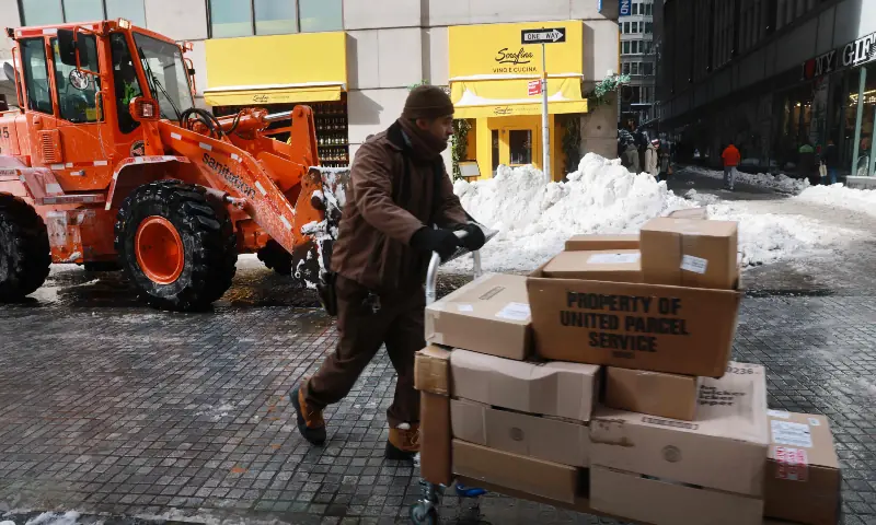 People walk through snow and ice covered streets as New York City experiences frigid temperatures following a winter storm over the weekend, in New York City on January 27, 2026. &mdash; AFP