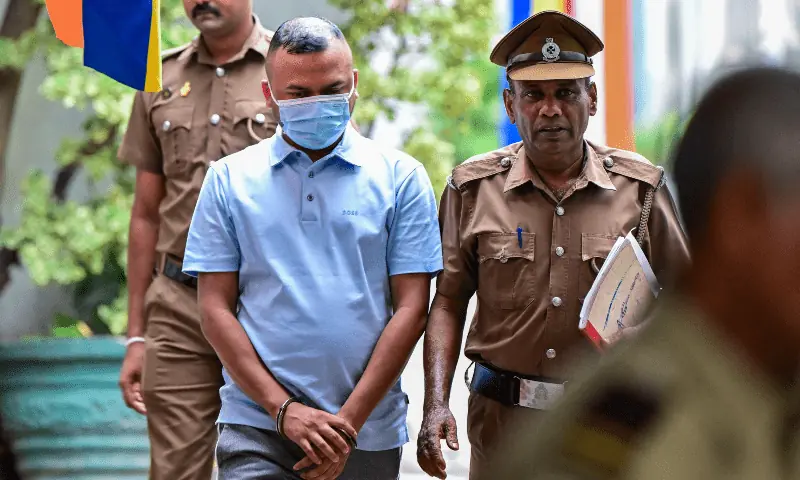 Tamim Rahman (C), a foreign owner of Dambulla Thunders team in Sri Lanka’s Premier League (LPL), is escorted to prison after his arrest in Colombo on May 22, 2024. — AFP/File Tamim Rahman (C), a foreign owner of Dambulla Thunders team in Sri Lanka’s Premier League (LPL), is escorted to prison after his arrest in Colombo on May 22, 2024. — AFP/File