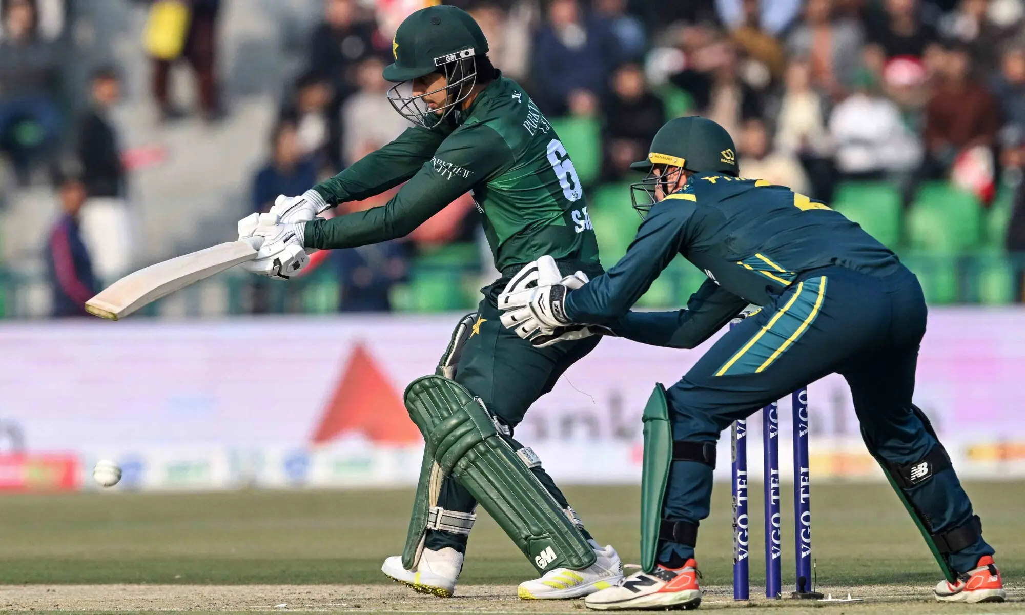 Saim Ayub (L) plays a shot during the first Twenty20 international cricket match between Pakistan and Australia at the Gaddafi Stadium in Lahore on January 29. &mdash; AFP