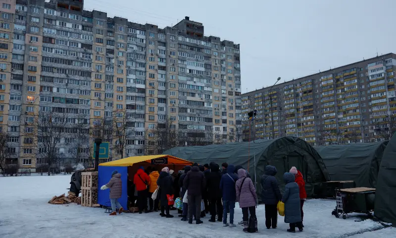 Residents receive hot meals from volunteers next to tents at a government‑run humanitarian aid point, where people can warm up, charge their devices, get hot drinks and meals, and receive psychological support, during a power blackout after critical civilian infrastructure was hit by recent Russian missile and drone strikes, amid Russia’s attack on Ukraine, in Kyiv, Ukraine on January 30, 2026. — Reuters Residents receive hot meals from volunteers next to tents at a government‑run humanitarian aid point, where people can warm up, charge their devices, get hot drinks and meals, and receive psychological support, during a power blackout after critical civilian infrastructure was hit by recent Russian missile and drone strikes, amid Russia’s attack on Ukraine, in Kyiv, Ukraine on January 30, 2026. — Reuters
