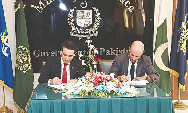 PAKISTAN’S crypto czar Bilal Bin Saqib signs an agreement with a representative of World Liberty Financial in April. — Dawn archive PAKISTAN’S crypto czar Bilal Bin Saqib signs an agreement with a representative of World Liberty Financial in April. — Dawn archive