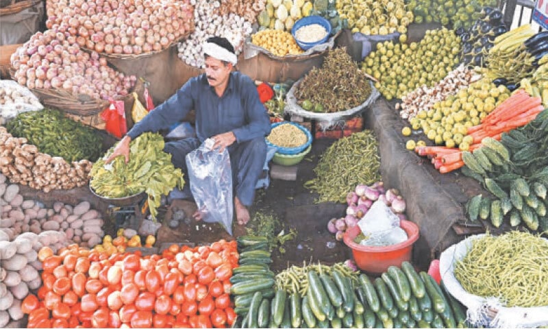 A man is seen selling vegetables in this file photo.&mdash;Dawn/file