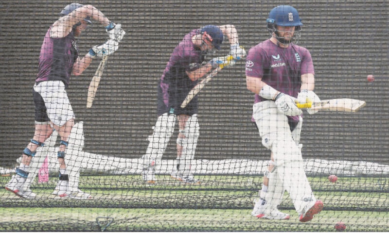 SYDNEY: England captain Ben Stokes (L) plays a shot next to team-mates Ben Duckett (R) and Harry Brook during a training session at the Sydney Cricket Ground on Friday.&mdash;AFP