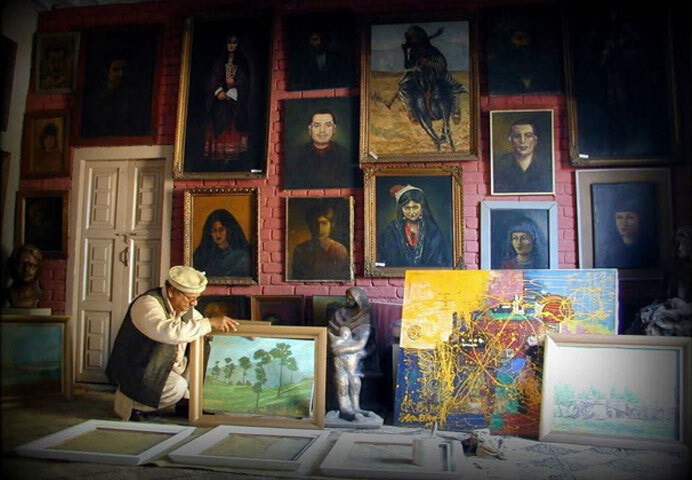 Painter and sculptor Arbab Muhammad Sardar in his gallery: in 1997, after receiving threats warning him against painting human faces and creating sculptures, he began removing his works from display.