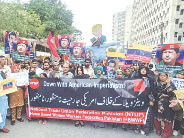 People stage a rally in protest over the US invasion of Venezuela.—White Star