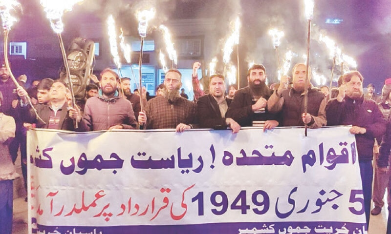 Activists participate in a torch-bearing rally organised by Pasban-i-Hurriyat Jammu Kashmir in Muzaffarabad to press for the right to self-determination for the people of India-held Kashmir. &mdash; Photo by Tariq Naqash
