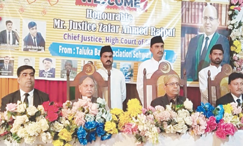 SINDH High Court Chief Justice Zafar Ahmad Rajput, alongside other judges, addresses lawyers at the Sehwan Sharif Taluka Bar Association.&mdash;Dawn