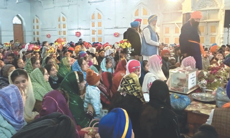 Devotees offer rituals in connection with the birth anniversary of Guru Gobind Singh at Gurdwara Panja Sahib in Hassanabdal on Monday. &mdash; Dawn