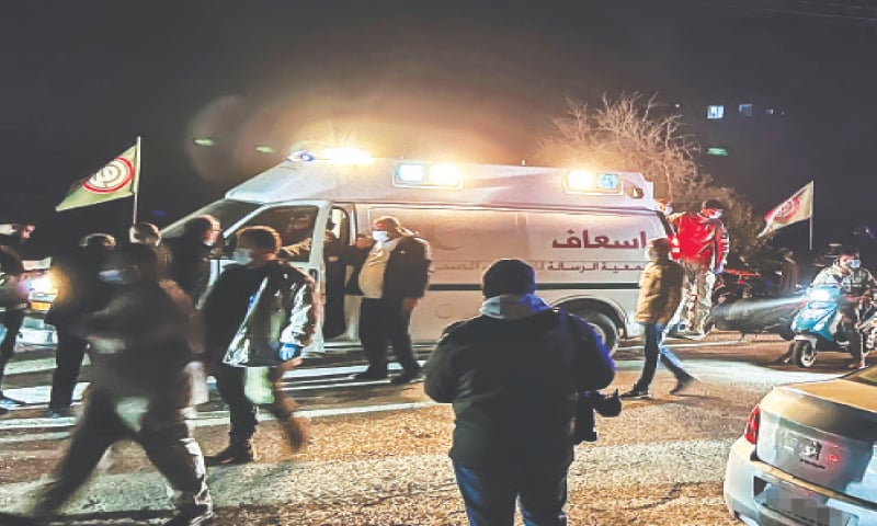 Personnel of emergency services arrive at the scene following an Israeli air strike on the village of Kfar Hatta, in southern Lebanon.&mdash;AFP