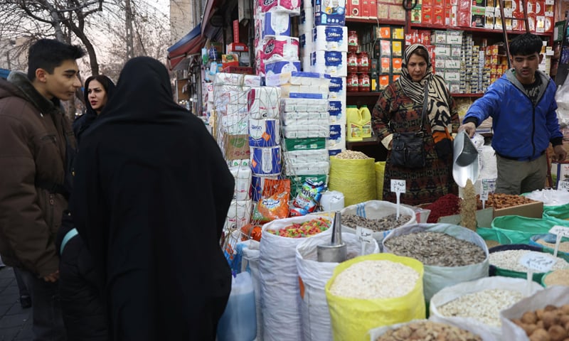 A WOMAN shops at a store in Tehran as the unrest sweeping Iran over the collapse of the local currency&rsquo;s value eased, with life returning to normal in the capital&rsquo;s streets and markets.&mdash;Reuters