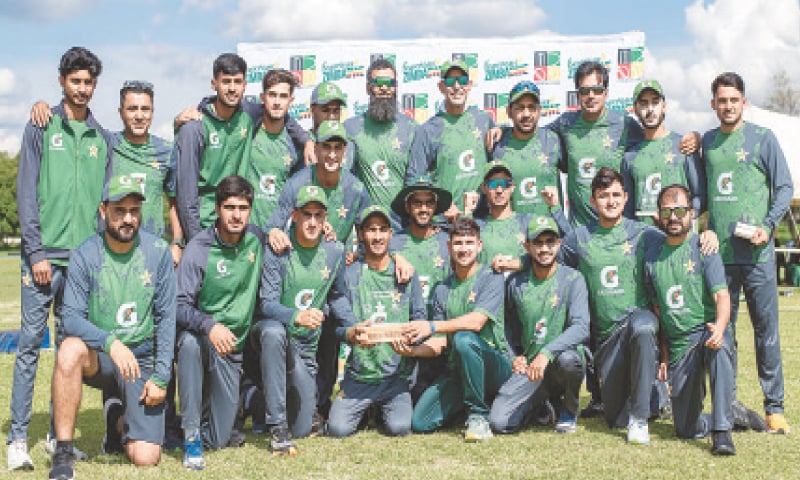 HARARE: Players and officials of the Pakistan&rsquo;s under-19 team pose with the series trophy after beating Zimbabwe in the tri-series final at the Old Hararians Sports Club on Tuesday.&mdash;Courtesy Zimbabwe Cricket