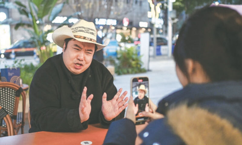 PRESIDENT Donald Trump’s impersonator Ryan Chen speaks as his assistant records a video.—AFP/file PRESIDENT Donald Trump’s impersonator Ryan Chen speaks as his assistant records a video.—AFP/file