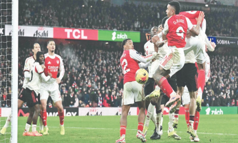 LONDON: Arsenal’s Gabriel Magalhaes (obscured) has a final chance at the back post from a corner as the last action of the Premier League match against Liverpool at the Emirates Stadium.—AFP LONDON: Arsenal’s Gabriel Magalhaes (obscured) has a final chance at the back post from a corner as the last action of the Premier League match against Liverpool at the Emirates Stadium.—AFP