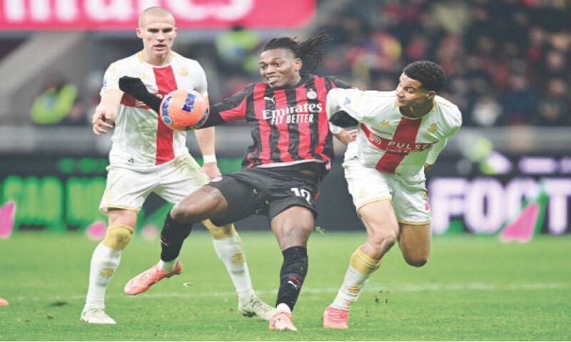 MILAN: AC Milan’s Rafael Leao (C) fights for the ball with Genoa’s Leo Ostigard (L) and Alessandro Marcandalli during their Serie A match at San Siro.—Reuters MILAN: AC Milan’s Rafael Leao (C) fights for the ball with Genoa’s Leo Ostigard (L) and Alessandro Marcandalli during their Serie A match at San Siro.—Reuters