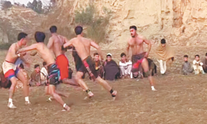 Players in action during a kabaddi match in Chota Lahor tehsil of Swabi district. &mdash; Dawn