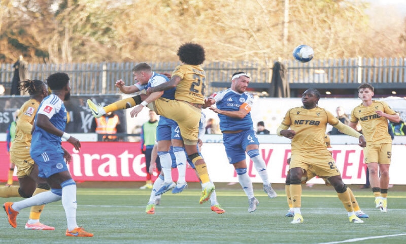 MACCLESFIELD: Macclesfield FC&rsquo;s Paul Dawson (C) scores during the FA Cup third-round match against Crystal Palace at Moss Rose on Saturday. &mdash; Reuters
