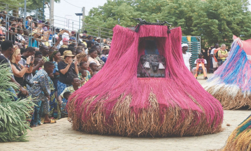 DEVOTEES wearing masks take part in the voodoo festival in Ouidah, Benin.—Reuters DEVOTEES wearing masks take part in the voodoo festival in Ouidah, Benin.—Reuters