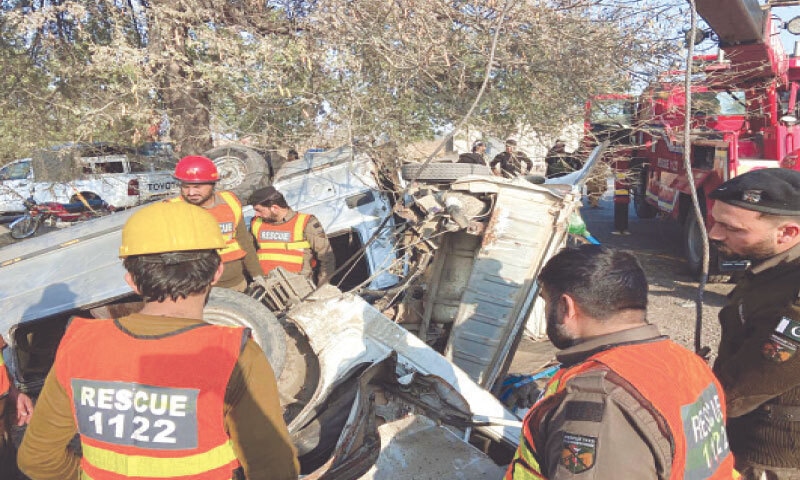 Rescuers separate two vehicles from each other after a collision on Kohat Road near Badhber in Peshawar on Sunday. &mdash; White Star