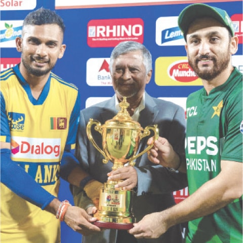  SRI LANKAN captain Dasun Shanaka (L) and his Pakistan counterpart Salman Ali Agha pose with the Twenty20 International series trophy after the third match at the Rangiri Dambulla International Stadium.&mdash;AFP
