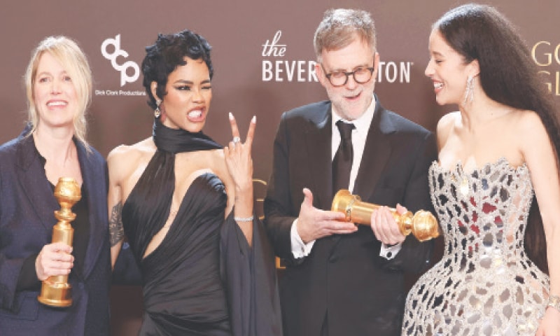 Sara Murphy, Teyana Taylor, Paul Thomas Anderson and Chase Infiniti, who won the &lsquo;Best Motion Picture &mdash; Musical or Comedy Award&rsquo; for One Battle After Another, pose during the 83rd annual Golden Globe Awards.&shy;&mdash;AFP