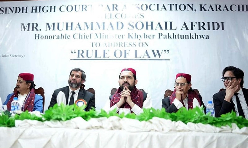 FLANKED by PTI secretary general Salman Akram Raja and others, KP CM Sohail Afridi attends a Sindh High Court Bar Association event.—PPI FLANKED by PTI secretary general Salman Akram Raja and others, KP CM Sohail Afridi attends a Sindh High Court Bar Association event.—PPI