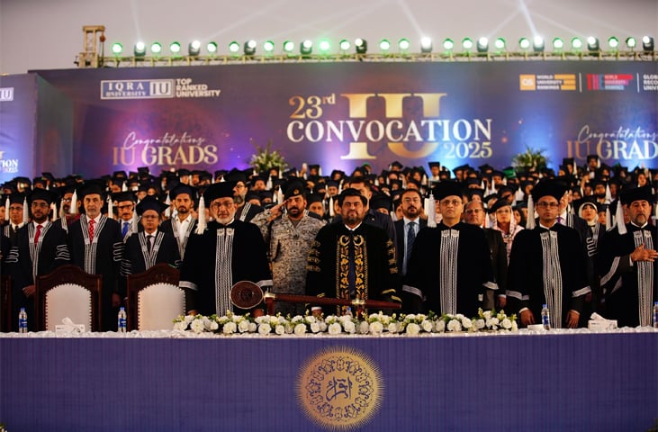 Governor Kamran Tessori, university officials and students stand in honour of the national anthem during the convocation.&mdash;Dawn