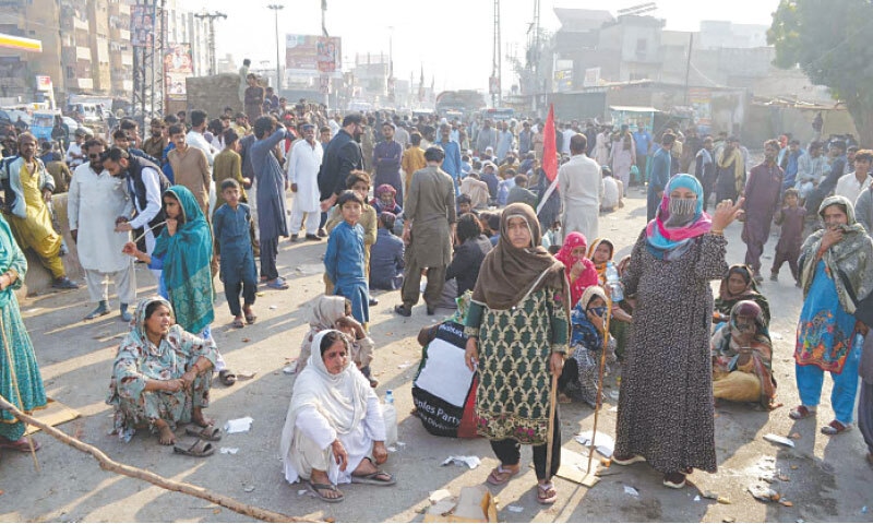 occupants of land, whose houses were demolished during an anti-encroachment drive near Saima Plaza, stage a protest sit-in on the National Highway at Hala Naka.—By Umair Ali occupants of land, whose houses were demolished during an anti-encroachment drive near Saima Plaza, stage a protest sit-in on the National Highway at Hala Naka.—By Umair Ali