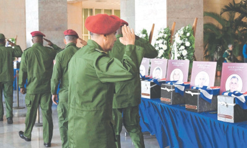 Cuban military personnel salute caskets during a remembrance in Havana for the 32 soldiers who died during the US incursion to capture Venezuelan leader Nicolas Maduro.—AFP Cuban military personnel salute caskets during a remembrance in Havana for the 32 soldiers who died during the US incursion to capture Venezuelan leader Nicolas Maduro.—AFP