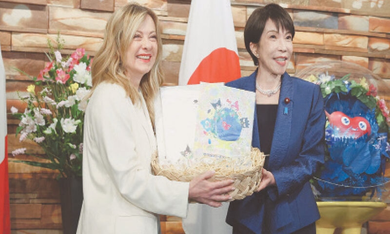 Italy&rsquo;s Prime Minister Georgia Meloni (left) and her Japanese counterpart Sanae Takaichi shake hands during their meeting in Tokyo&mdash;AFP