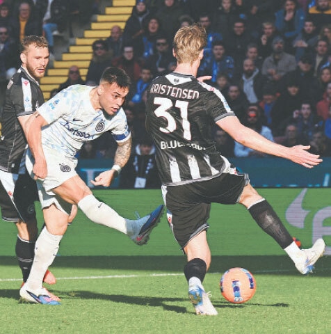 UDINE: Inter Milan’s Lautaro Martinez shoots to score during the Serie A match against Udinese at the Bluenergy Stadium on Saturday.—Reuters