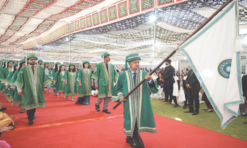 Prof Emeritus Mushtaq Ahmed leads the procession of graduates during the convocation.
