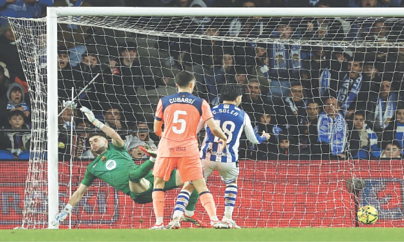 SAN SEBASTIAN: Real Sociedad&rsquo;s Mikel Oyarzabal scores past Barcelona goalkeeper Joan Garcia during their La Liga match at the Reale Arena.&mdash;Reuters