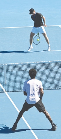  AUSTRALIA&rsquo;S Dane Sweeny hits a tweener against Gael Monfils of France during their Australian Open match at the Melbourne Park on Tuesday.&mdash;AFP 