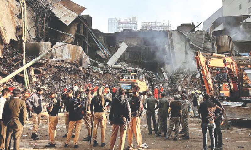 POLICE and city officials look on as heavy machinery is used to comb through the rubble of the gutted Gul Plaza shopping mall, on Karachi&rsquo;s M.A. Jinnah Road.&mdash;Fahim Siddiqi / White Star