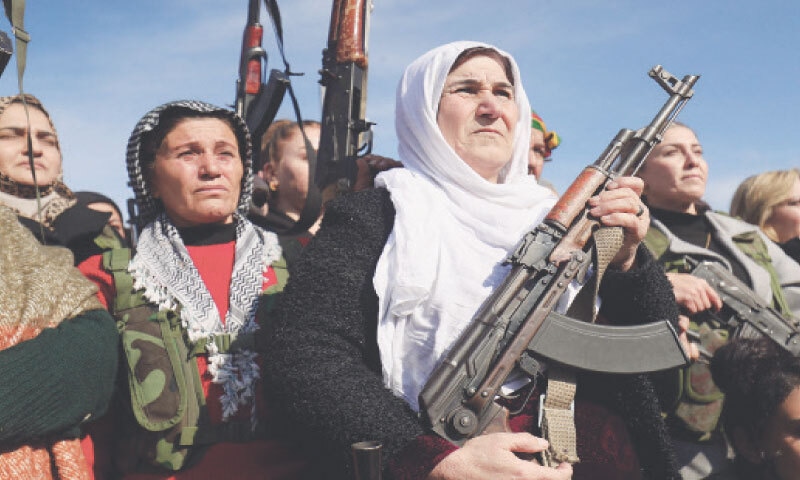 CIVILIANS gather with their weapons in Qamishli as Kurdish forces called upon &ldquo;young Kurds, men and women&rdquo; both within and outside Syria to &ldquo;join the ranks of the resistance&rdquo;.&mdash;AFP