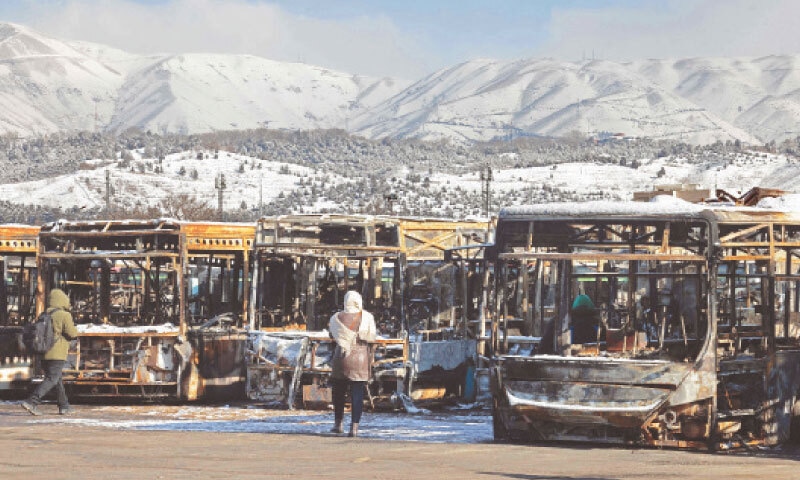 TEHRAN: The gutted shells of buses are seen parked at a depot on the outskirts of the Iranian capital, during a tour for foreign media representatives following widespread protests across the country. Iranian state media reported on Wednesday that at least 3,117 people were killed during recent protests, which activists claim were suppressed with a deadly crackdown.&mdash;AFP