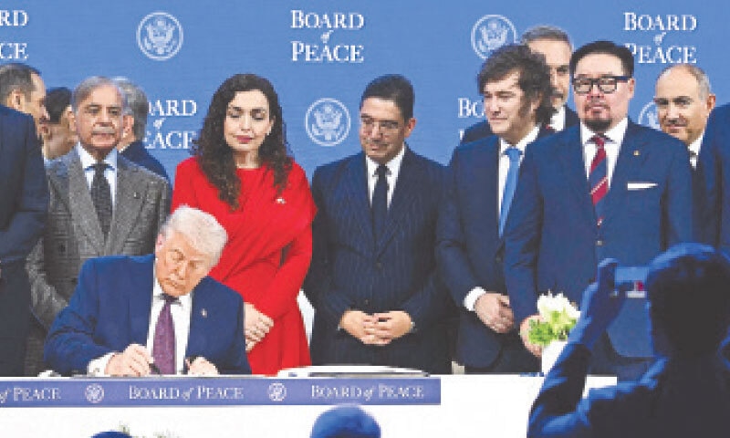 (LEFT to right) PM Shehbaz Sharif, Kosovo&rsquo;s President Vjosa Osmani, Morocco&rsquo;s Foreign Minister Nasser Bourita, Argentinian President Javier Milei, Turkish Foreign Minister Hakan Fidan, Mongolian PM Gombojav Zandanshatar, Armenia&rsquo;s premier Nikol Pashinyan and others look on as US President Donald Trump signs the founding charter of the &lsquo;Board of Peace&rsquo; at a ceremony in Davos.&mdash;AFP