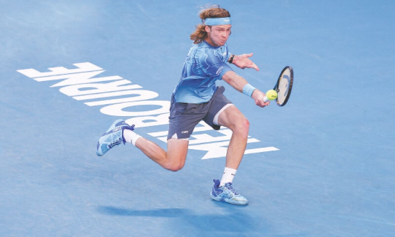 RUSSIA&rsquo;S Andrey Rublev hits a backhand against Francisco Cerundolo of Argentina during their Australian Open third-round match at the Melbourne Park on Friday.&mdash;AFP