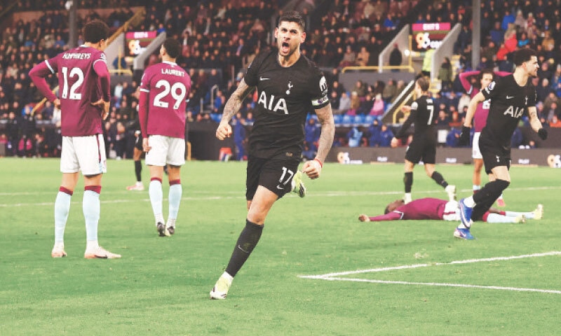 BURNLEY: Tottenham Hotspur’s Cristian Romero celebrates after scoring the equaliser during the Premier League match against Burnley at Turf Moor on Saturday.—Reuters