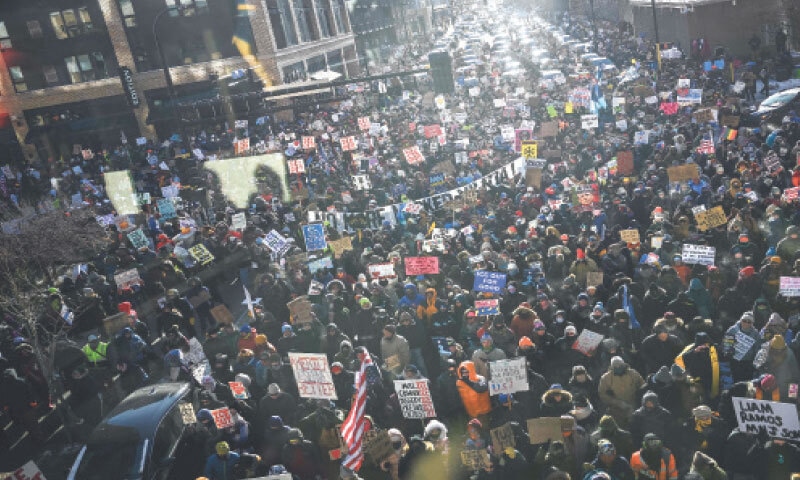 MINNEAPOLIS (Minnesota, US): Demonstrators participate in a rally and march during an &lsquo;ICE Out&rsquo; day of protest. Community leaders, faith leaders and labour unions have urged Minnesotans to participate in what they are calling a  &lsquo;day of action&rsquo; as local businesses are expected to close during a statewide general strike held in protest against immigration enforcement operations in the region.&mdash;AFP