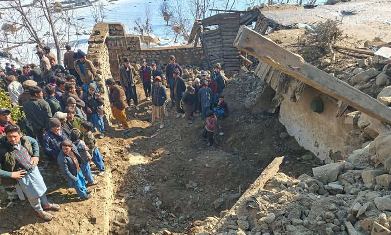 LOCALS gather at the site after a watchtower on a house collapsed on Saturday due to recent heavy snowfall in Diamer, Gilgit-Baltistan.&mdash;Dawn