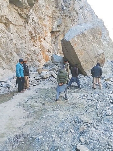 HEAVY boulders block the Astore Valley road, leaving travellers on both sides stranded.—Dawn