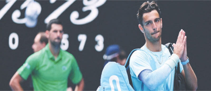 ITALY’S Lorenzo Musetti applauds the fans and walks off the court after retiring from his quarter final match against Serbia’s Novak Djokovic on Wednesday.—Reuters