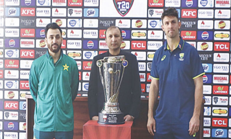 PAKISTAN captain Salman Ali Agha (L) poses with the T20 series trophy    along with his Australian counterpart Mitchell Marsh at the Gaddafi Stadium on Wednesday.&mdash;M. Arif/White Star
