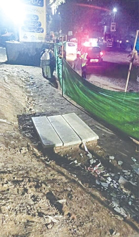 Bhati manhole is now covered with slabs and secured with a net. &mdash; Dawn