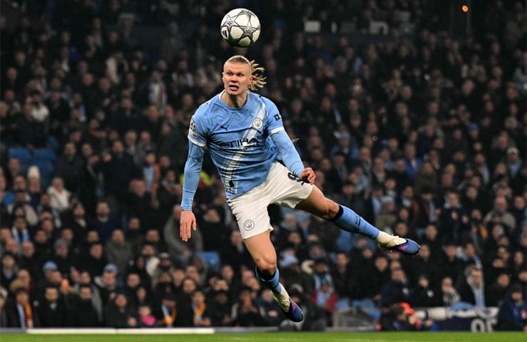 MANCHESTER: Erling Haaland of Manchester City heads the ball during the match against Galatasaray at the Etihad Stadium.—AFP